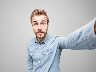 Handsome man takes a selfie