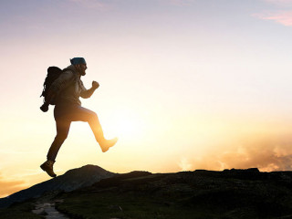 Male backpacker walking in mountains