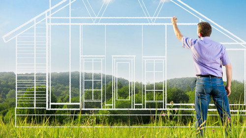 Man drawing a house blueprint in nature
