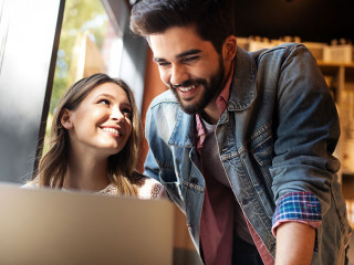 Young couple or college student using laptop computer notebook work together