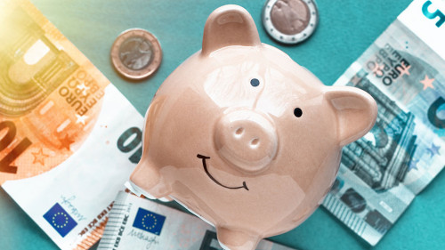 piggy bank concept isolated on blue background