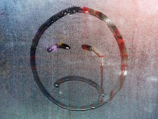 Sad smiley of raindrops