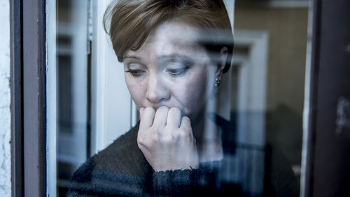 dramatic close up portrait of young beautiful woman thinking and