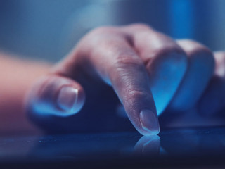 Woman reading online news on digital tablet