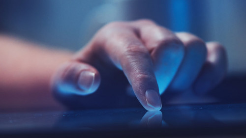 Woman reading online news on digital tablet