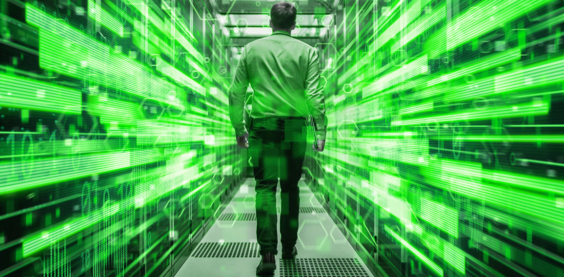 Shot of a Young It Specialist Walking through Corridor in Workin