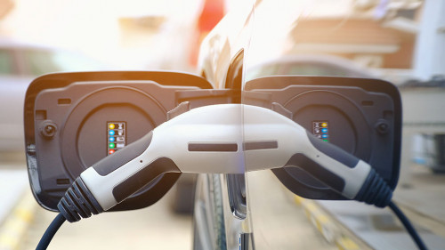 Charging modern electric car battery on the street which are the