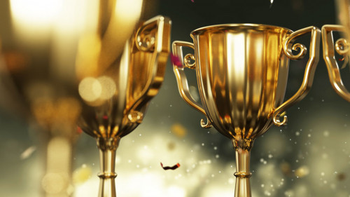 close up golden trophy award with falling confetti. copy space f