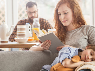 Son lying on mother's laps