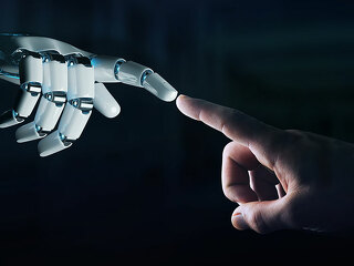 Robot hand making contact with human hand on dark background 3D