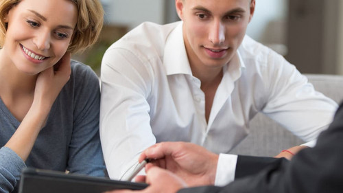 couple meeting financial adviser for investment