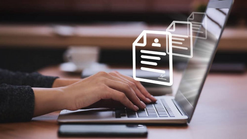 Concept of electronic signature. Woman working on laptop at tabl