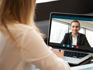 Business woman making video call to business partner via applica