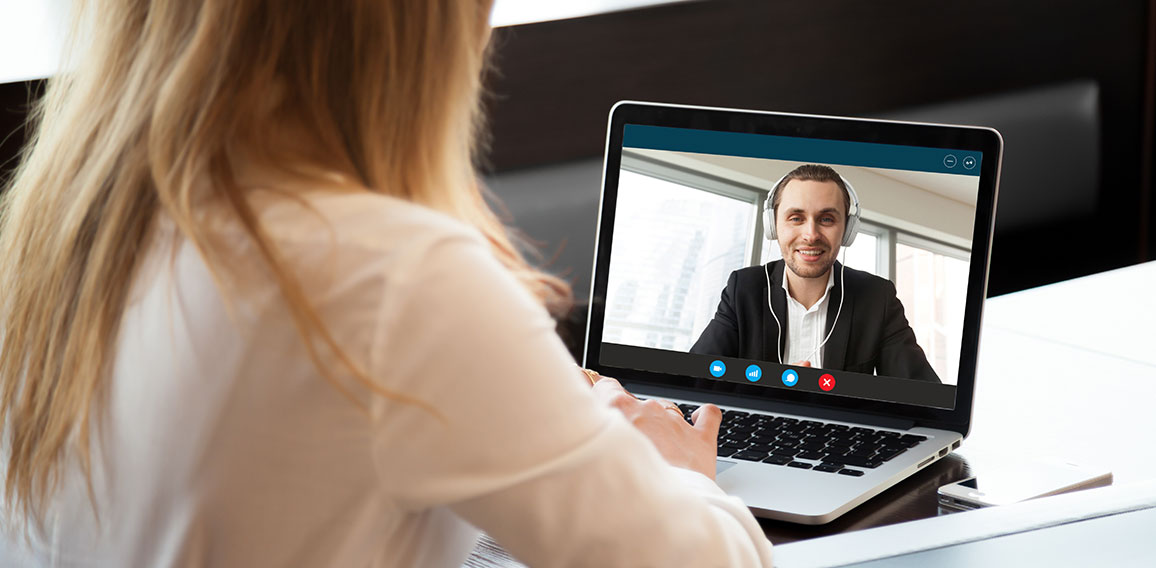 Business woman making video call to business partner via applica
