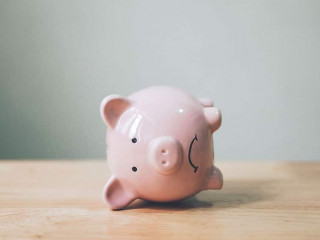 Piggy bank on wood table. Financial investment and save money concept