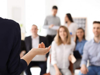 Female business trainer giving lecture in office