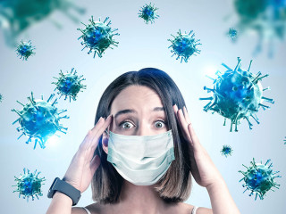 Scared young woman in mask, coronavirus panic