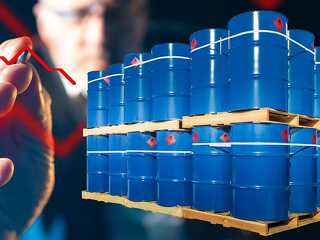 Barrels for loading. Metal drums stand on wooden pallets. Chemic