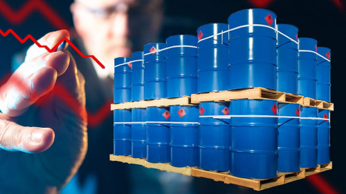 Barrels for loading. Metal drums stand on wooden pallets. Chemic