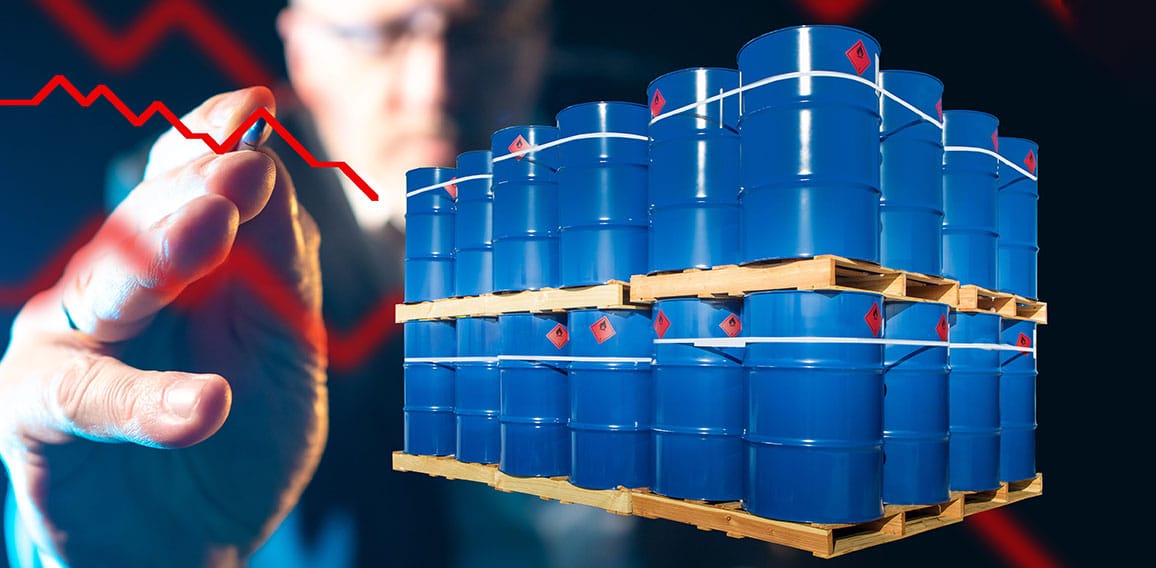 Barrels for loading. Metal drums stand on wooden pallets. Chemic