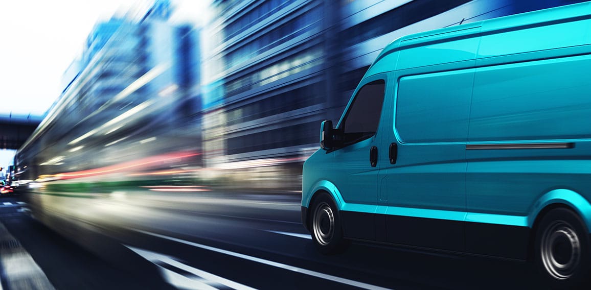 Transportation service with a cyan van moving fast on the road