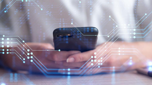 Businesswoman in formal wear holding in the hands a smart phone and testing an innovative application to provide a completely new service. Close up shot. Hologram tech graphs. Concept of Dev team.