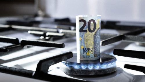 Concept of gas crisis. 20 euro bank note is burning on a kitchen stove. Cash money. High prices of natural resources. Blue flame. Utility debt. Number twenty. Energy war. Saving home budget. Finance