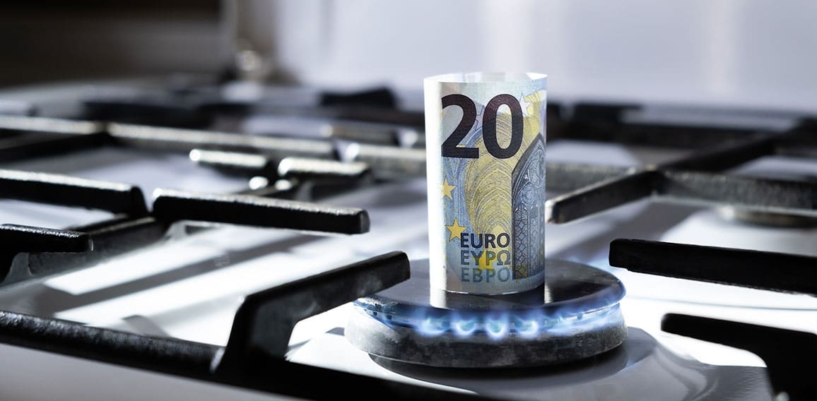 Concept of gas crisis. 20 euro bank note is burning on a kitchen stove. Cash money. High prices of natural resources. Blue flame. Utility debt. Number twenty. Energy war. Saving home budget. Finance
