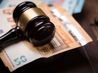 Judge s hammer gavel and euro money on a desk