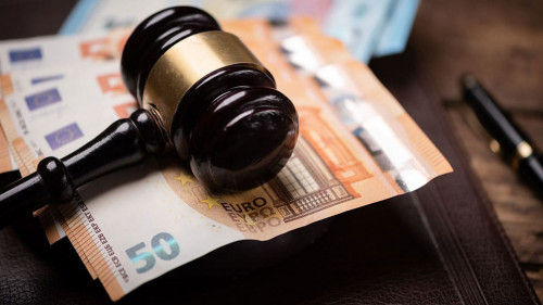 Judge s hammer gavel and euro money on a desk