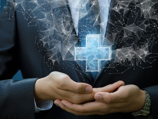 Businessman shows a hologram plus .