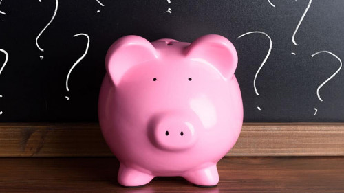 Piggy Bank With Question Mark On Black Board