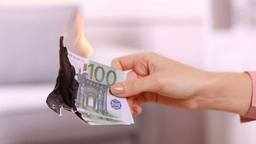 Woman burning Euros in the room