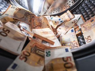 money laundering concept - euro banknotes in washing mashine