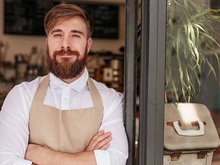 Handsome and confident cafe owner