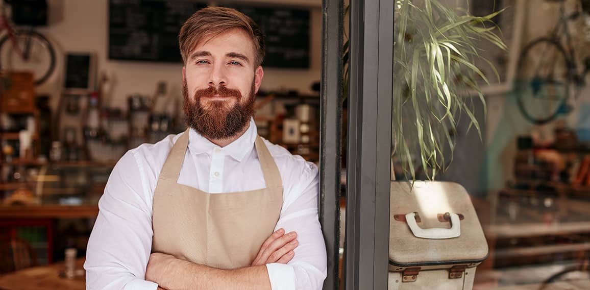 Handsome and confident cafe owner