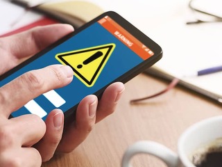 Security alert on smartphone display. Virus infected smartphone