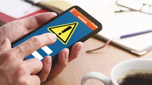 Security alert on smartphone display. Virus infected smartphone