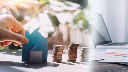 stacking dollars coins with a house model.save and investment fo