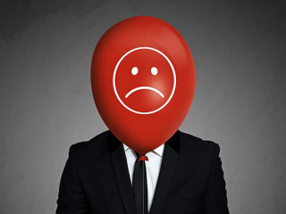 Businessman with balloon