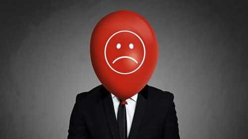 Businessman with balloon