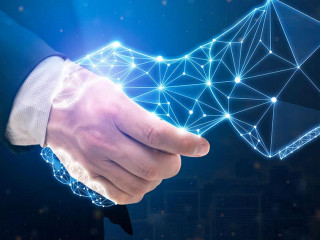 Businessperson shaking hand with digital partner over futuristic