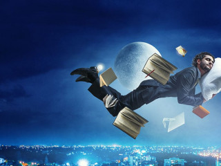 Joyful happe businessman levitating horizontally