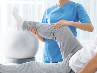 Doctor working with patient in hospital, closeup. Rehabilitation