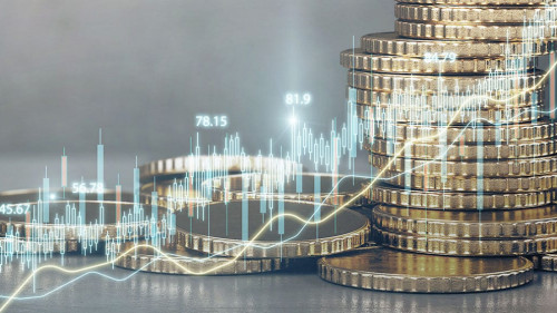 Abstract glowing candlestick forex chart on blurry golden coins wallpaper. Money, economy and finance concept. Double exposure.