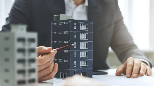 real estate developer and architect discussing new housing devel