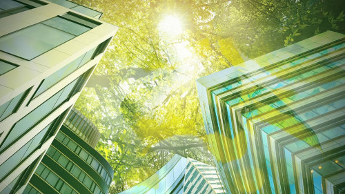 Go green concept. Low angle view of modern building and trees on