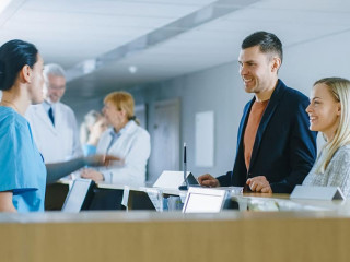 In the Hospital at the Reception Desk Nurse on Duty Answers Youn