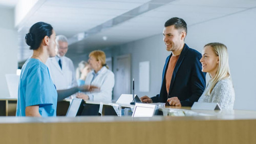 In the Hospital at the Reception Desk Nurse on Duty Answers Youn