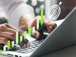 Businessman analyzing company's financial balance sheet working